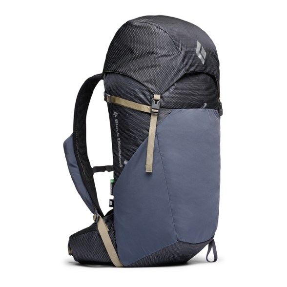 Black Diamond Trail Vista 28L Daypack in action on a mountain trail with a scenic view.