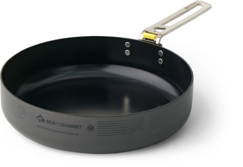 Frontier Ultralight frying pan at a campsite, showcasing its nonstick surface and removable handle.