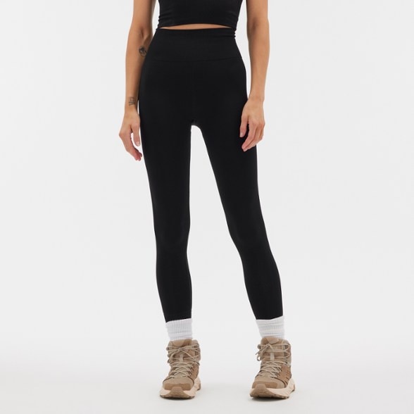 Sophia high-waisted leggings displayed on a female model in an outdoor setting, showcasing their fit and design.