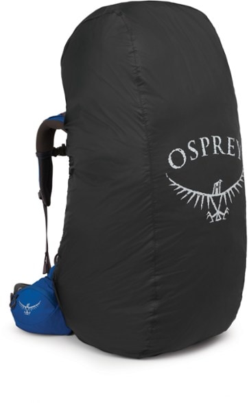 Osprey UltraLight raincover in action during a heavy downpour, protecting a large backpack.