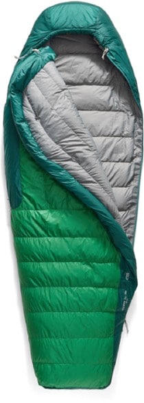 Summit Ascent 15F sleeping bag displayed in a forest camping site, showcasing its lightweight design.
