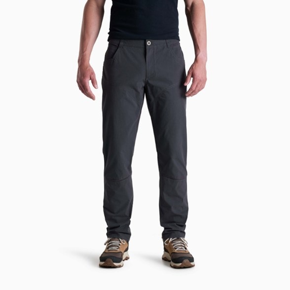 KÜHL AdventureTrek Men's Pants in a hiking setting, showcasing flexibility and comfort.
