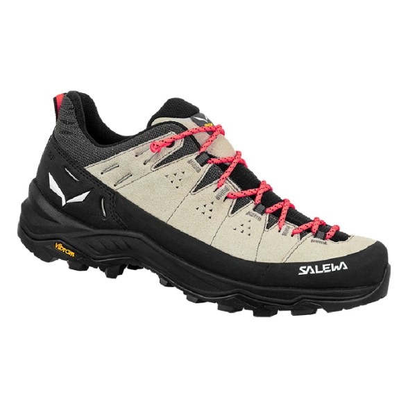 Salewa Women's Alp Trainer 2 Hiking Shoes on rocky terrain, showcasing the durable suede upper and Vibram outsole.