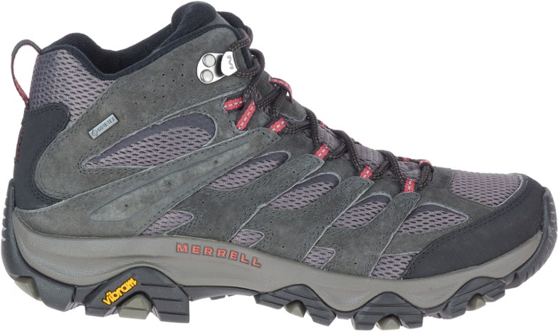Close-up of Merrell Moab 3 GORE-TEX boots showing Vibram sole with trail debris for scale