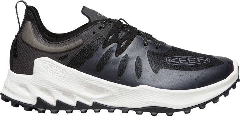 Zionic Speed Men's Hiking Shoes in action on a rocky trail, demonstrating lightweight support and flexibility.