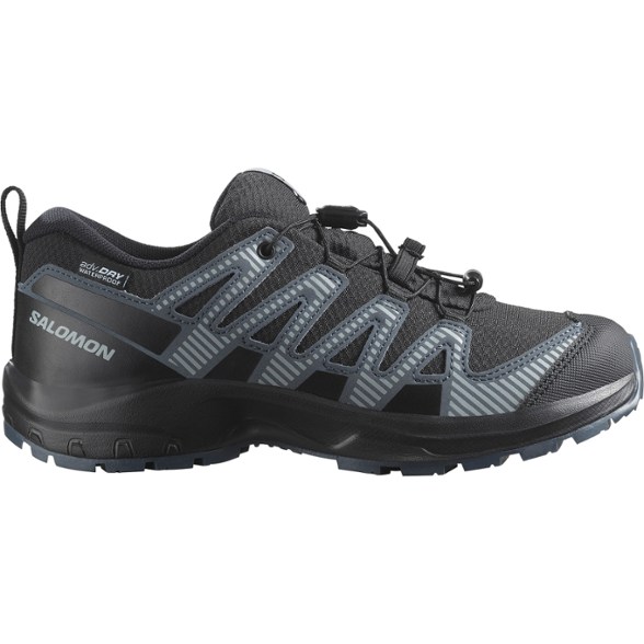 Side view of TrailBlaze Pro V8 kids waterproof hiking shoes showing durable outsole and protective toe cap
