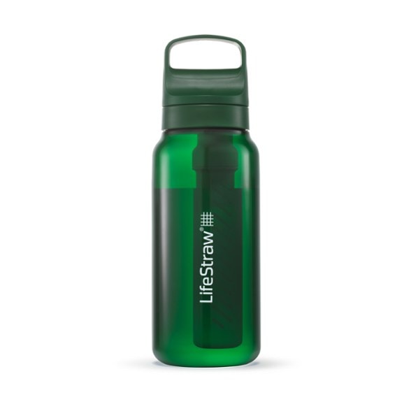 AquaShield water filter bottle in a hiking setting, showcasing its portability.