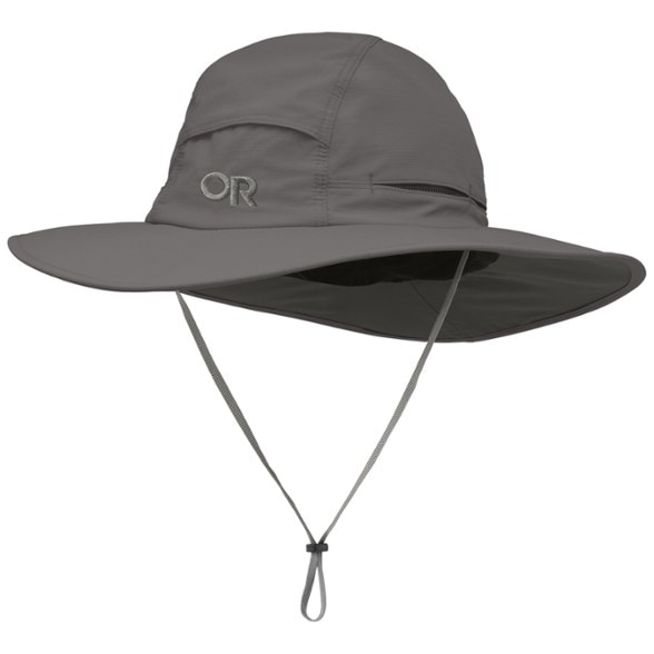 Side view of the wide brim sun hat with chin strap on a hiker in sunny terrain