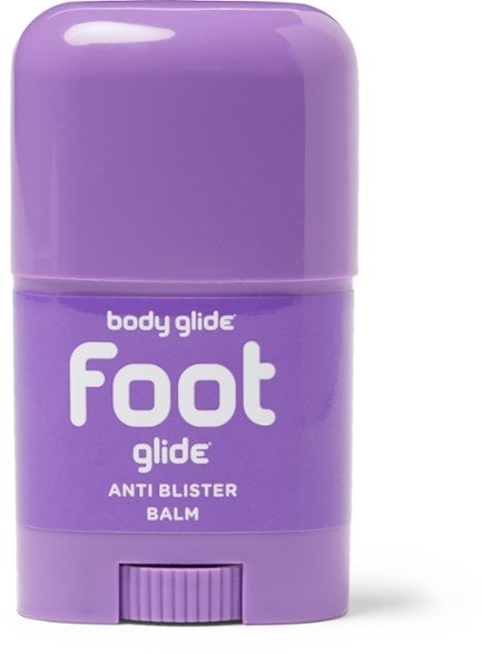 Foot Glide Anti-Chafing Stick applied on a hiker's feet, showing its protective layer