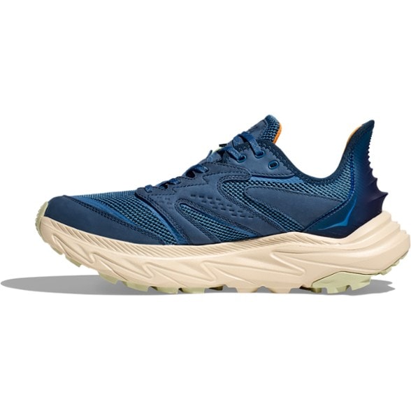 HOKA Anacapa 2 Freedom Men's Hiking Shoes from the side on a rocky trail.