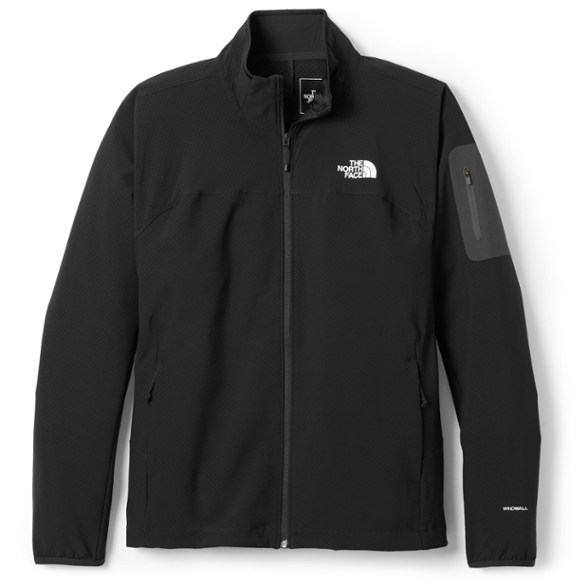 Wind-resistant men's soft shell jacket in action on a hiking trail.