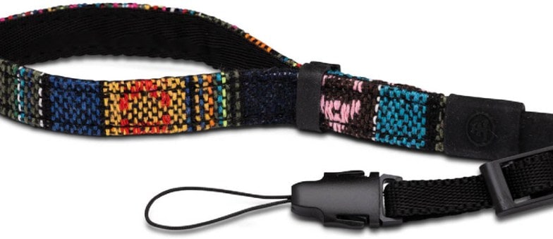 Close-up of woven wrist loop showing cotton jacquard pattern with quick release clips attached to a camera wrist strap