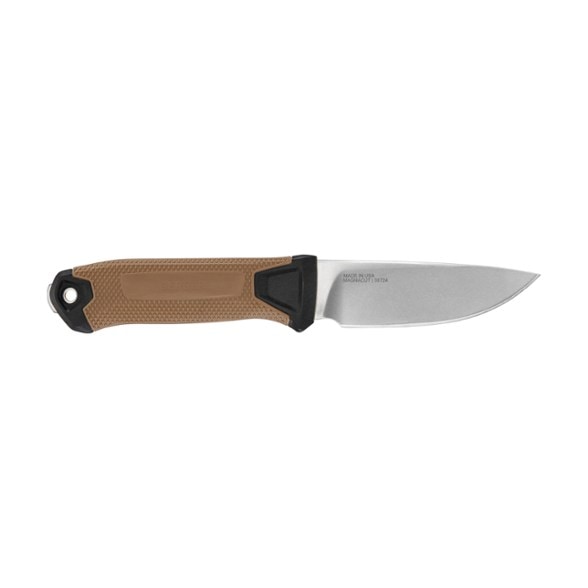 Gerber StrongArm camping knife on a log with trees in the background.