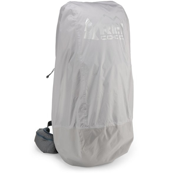 Waterproof rain cover for large backpacks shown in a downpour.