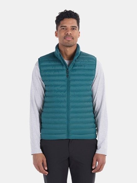 Men wearing the Eco-Friendly Featherless Insulated Vest while hiking.