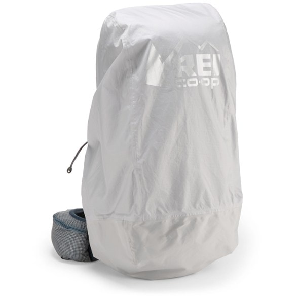 TrailGuard backpack rain cover on a 60L hiking pack in heavy rain
