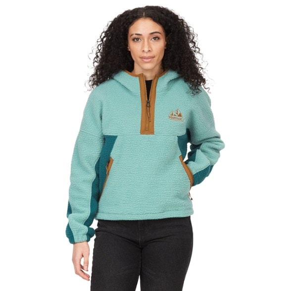 Marmot Women's Vintage Fleece Hoody in a cozy outdoor setting, highlighting its warm fabric and stylish design.