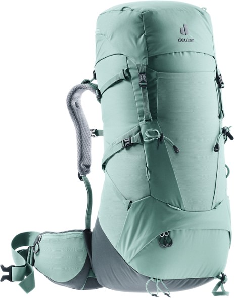 Side view of Trailform MaxCore pack loaded with sleeping pad, showing modular straps for gear attachment.