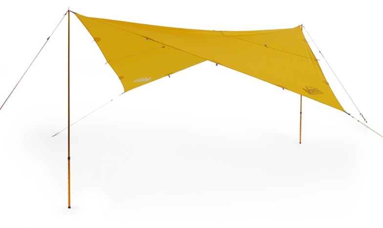 Eco-Friendly Lightweight Camping Tarp set up in a forest, showing waterproof capabilities and gear loops.