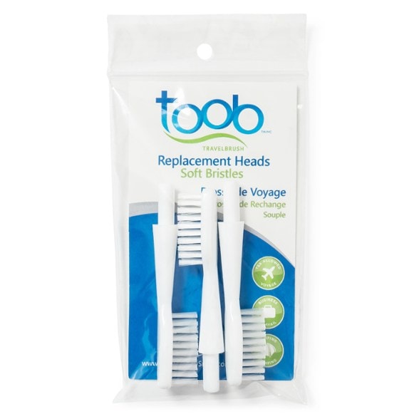 Close-up of TOOB replacement toothbrush heads showing soft bristles and compact design