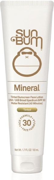 Close-up of Sun Bum Mineral SPF 30 tinted sunscreen lotion on a hand, showcasing its silky texture.