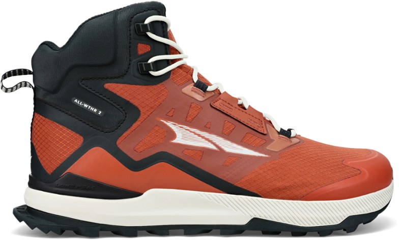 Altra ALL-WTHR Mid 2 hiking boots in action on rocky terrain with water resistance features.