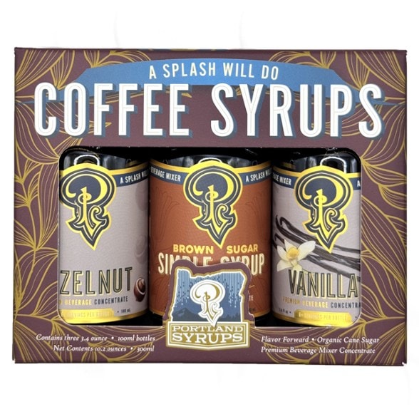 Gourmet coffee syrup kit with hazelnut, vanilla, and brown sugar flavors, showcasing travel-ready bottles.