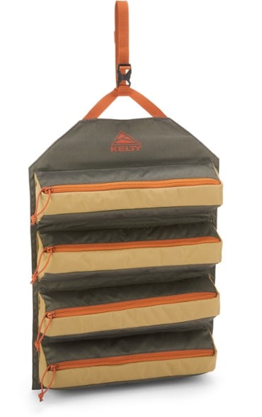 Ultimate Camping Chef Roll Bag hanging from a tree with utensils organized inside.