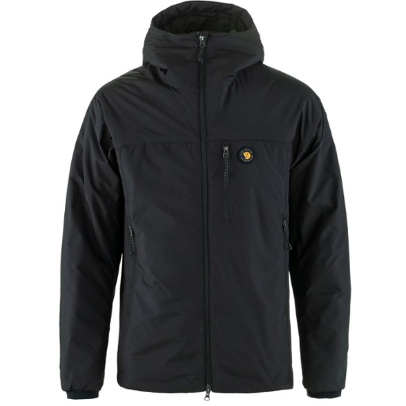 Front view of FjallTherm Trail Insulated Shell worn on a snowy ridge, showing lightweight insulated jackets for hiking.