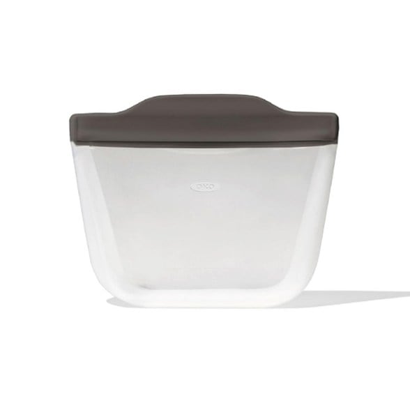 Durable silicone bag standing upright with snacks inside, perfect for camping.