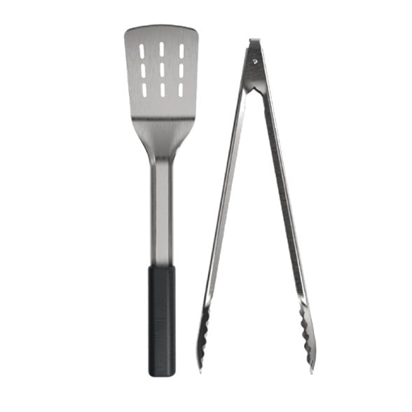 Close-up of UCO nesting grill tool set showing stainless steel spatula and tongs, ideal camping utensils