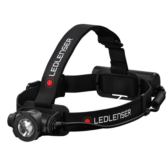 Ledlenser H7R Core headlamp showcasing its adjustable lamp head at a campsite.