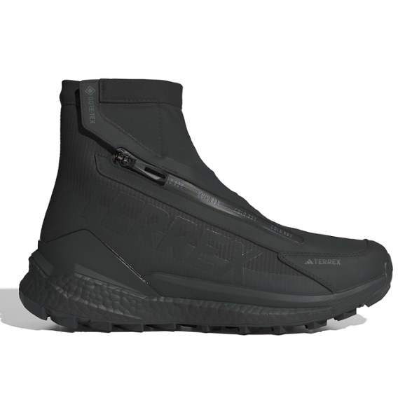 Side view of Adidas Terrex Free Hiker 2.0 COLD.RDY boots on a snowy trail.