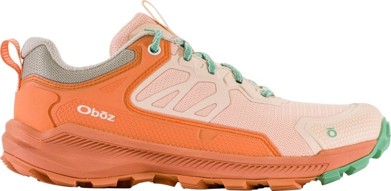 Side view of the Katabatic Women's Lightweight Hiking Shoes on rocky terrain.