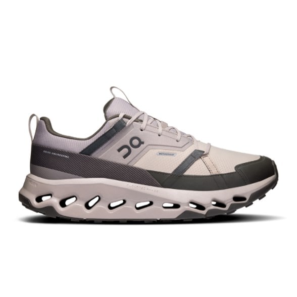 Side profile of CloudStride men's trail shoes on rocky terrain with visible waterproof mesh