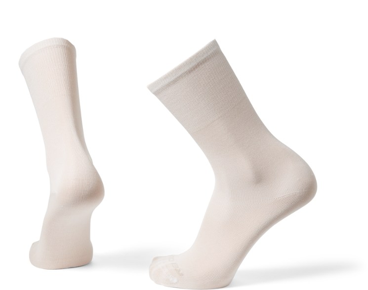 Close-up view of silk liner crew hiking socks showing fabric texture and stitching.