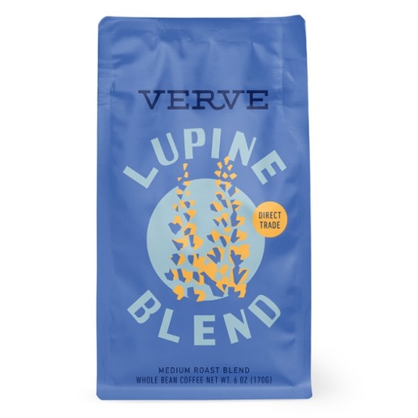Close-up of Lupine Adventure Whole Bean Coffee showcasing its rich beans and vibrant packaging.