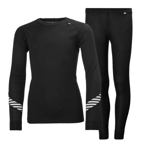 Front view of Helly Hansen kids thermal base layer set in action during a winter hike.