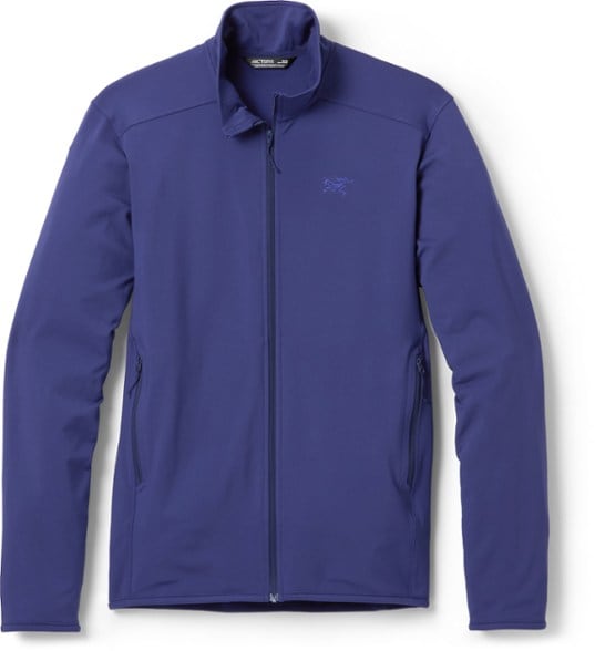 Men's Kyanite Lightweight Fleece Jacket in action on a hiking trail, demonstrating flexibility and comfort.