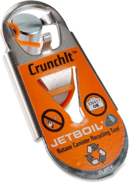 Eco-Friendly CrunchIt tool on a camping table with empty fuel canisters