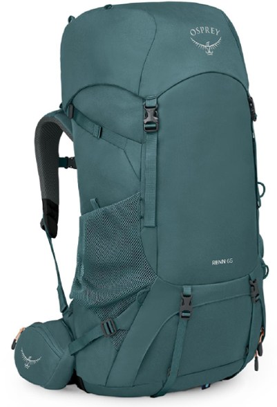 Osprey Renn 65 women's backpack with rain cover in a scenic mountain setting.