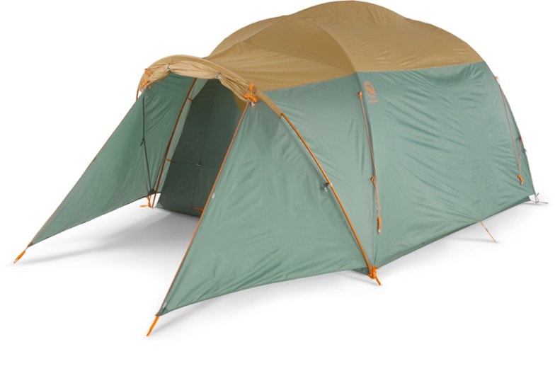 Bunk House 6 camping tent setup in a lush forest, showcasing two large doors and vestibules.