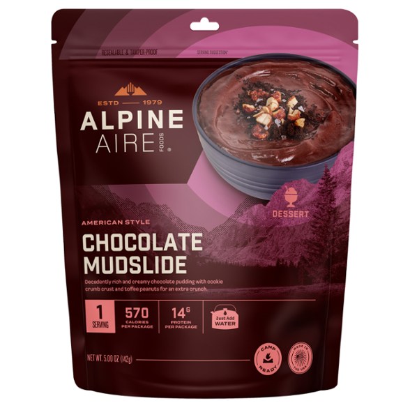 Decadent Chocolate Mudslide Pudding in a camping setting with nature background.