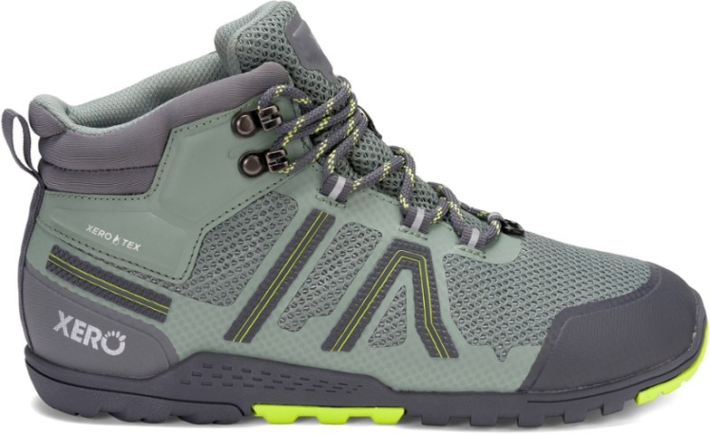 Side view of waterproof women's hiking boots with good traction on rugged trail