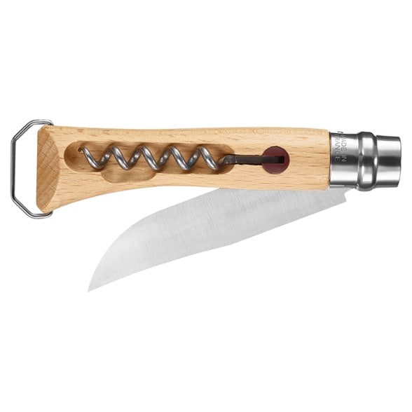 Outdoor Companion corkscrew folding knife displayed on a picnic table