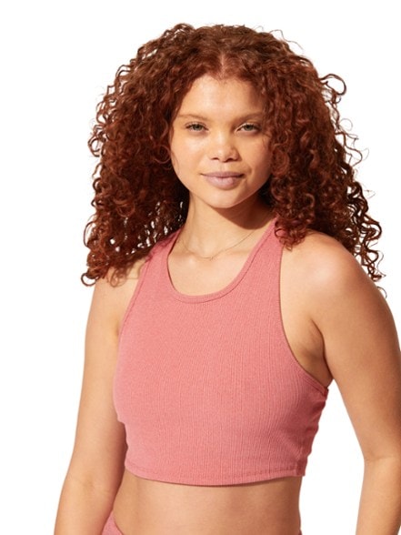 Front view of ribbed sports bra with medium support, shown on female athlete mid-workout.