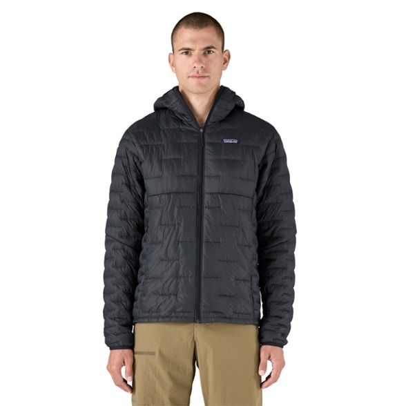 Men's insulated hoody in action, perfect for hiking in cold weather.