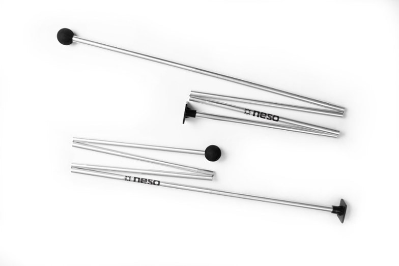 Neso Grande sunshade extra aluminum tent poles against a beautiful outdoor backdrop.