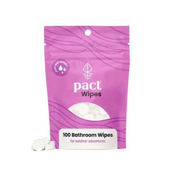 Eco-friendly bathroom wipes in a natural setting, ideal for camping and hiking.