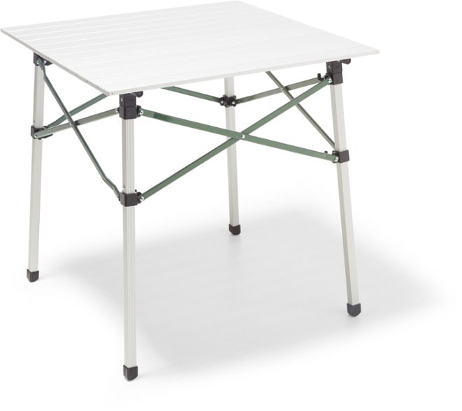 Aluminum roll-up camping table set up for meal prep at a campsite with hooks for hanging bags.